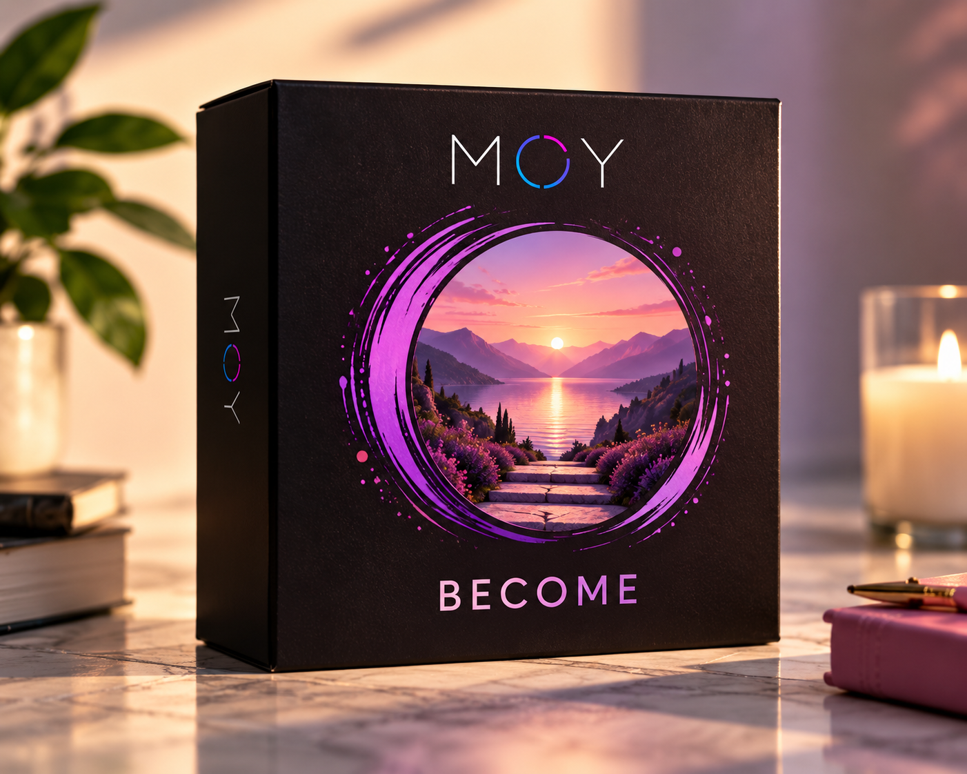 The black MOY BECOME box with violet-ringed lake sunset artwork.
